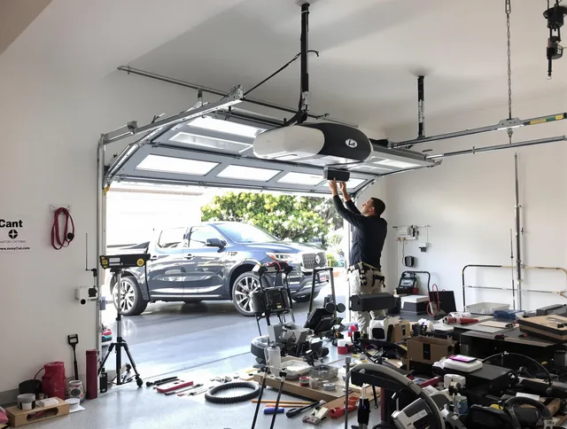 Kendale Lakes Garage Door Repair specialist installing smart garage door opener system in Kendale Lakes home