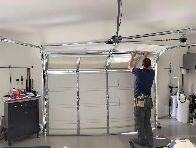 Kendale Lakes Garage Door Repair specialist performing precise section replacement on Kendale Lakes garage door